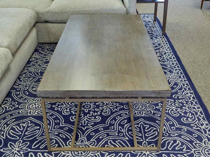 Lorts Driftwood Finish Top Cocktail Table with Taupe Metal Base