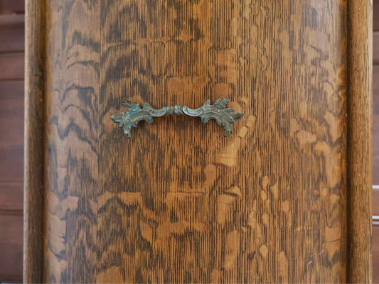 Curved Front Cabinet in Quartersawn Oak on Bun Feet with Brass Pull