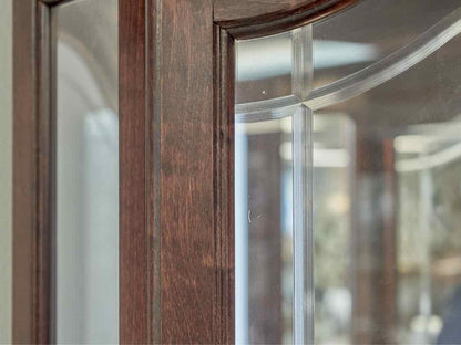 Howard Miller Cherry Lighted Corner Cabinet