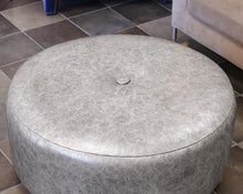 Norwalk Furniture Round Faux Leather Ottoman in Silver on Casters