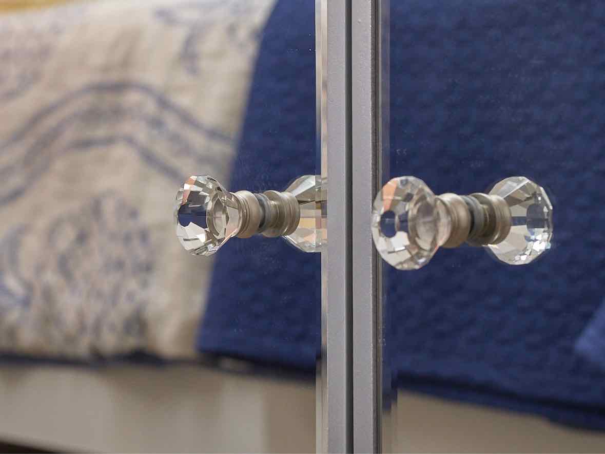 Elegant Mirrored Low Corner Cabinet