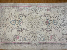 9' x 5.5' Beige Floral Area Rug