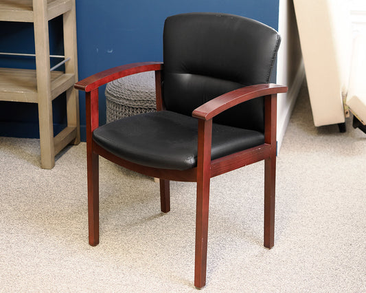Black Faux Leather Office Chair on Dark Wood Frame