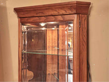 Howard Miller Oak Corner Display Curio Cabinet